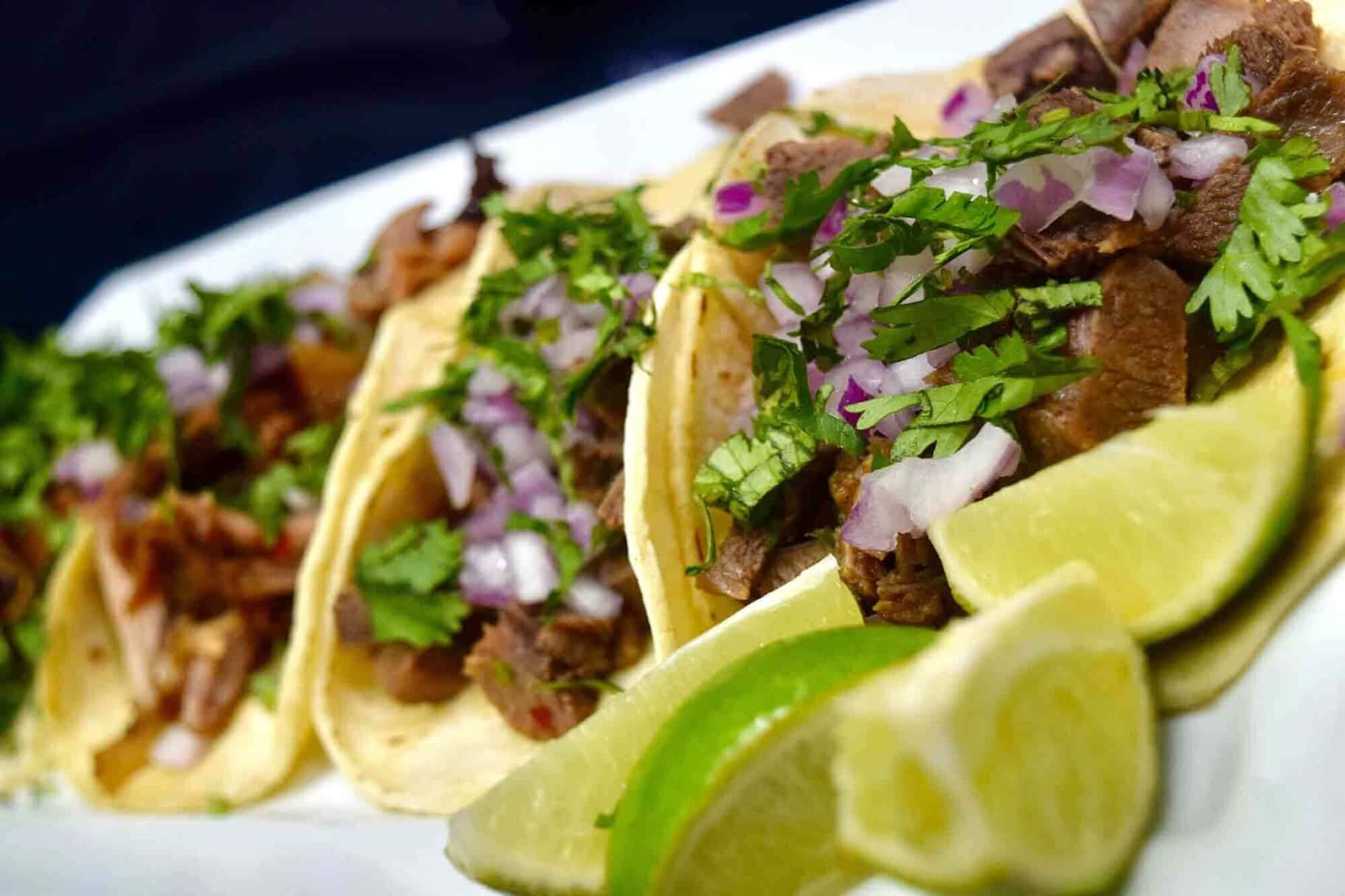Street-style Mexican tacos with cilantro and onion
