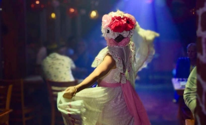Catrina performer in costume entertaining guests