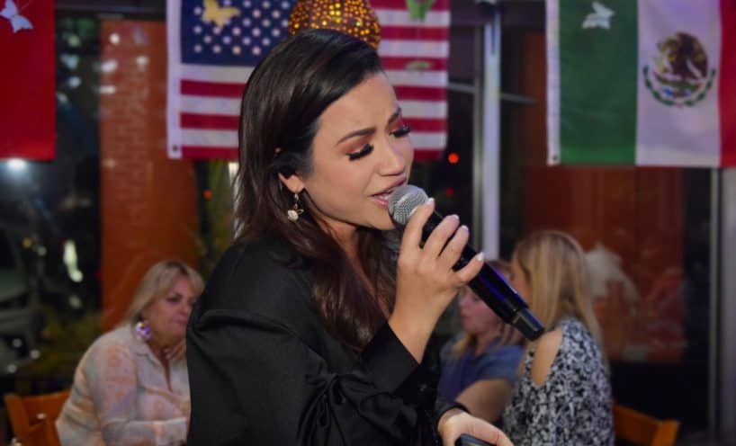 Vocalist singing live for guests on a weekend night