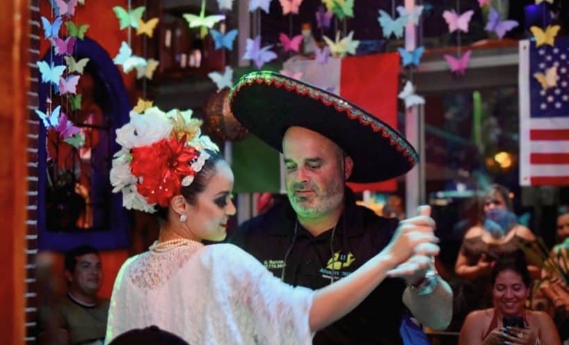 Folklórico dancers in traditional dress performing at La Herradura